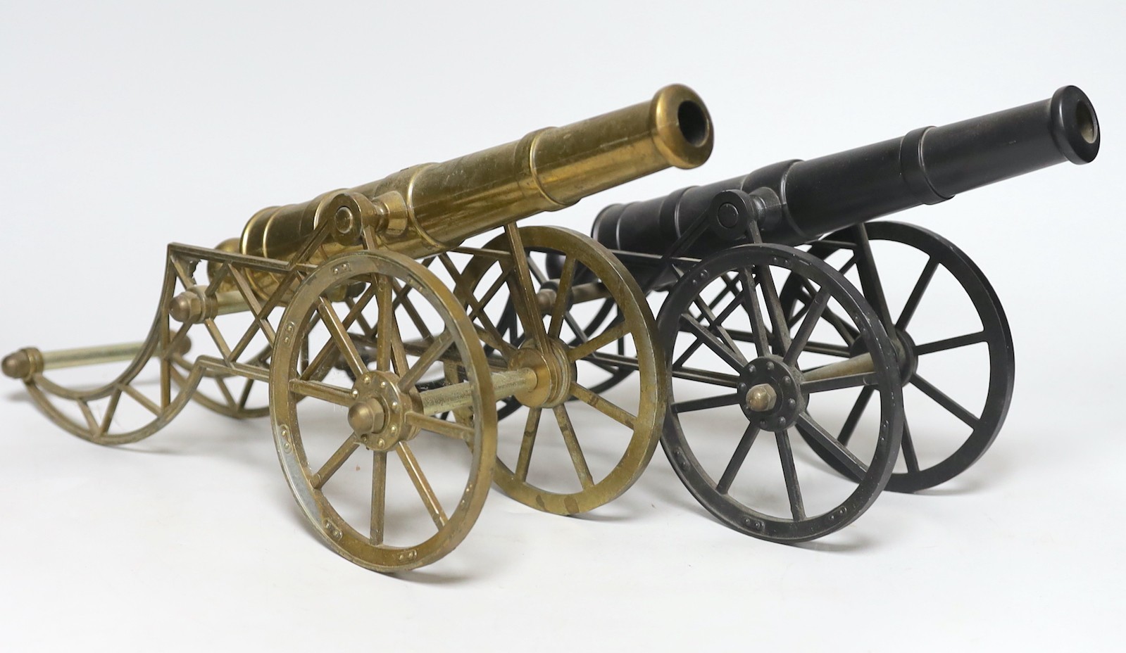 Two models of cannons, stamped G.A.A.D., 40cm long